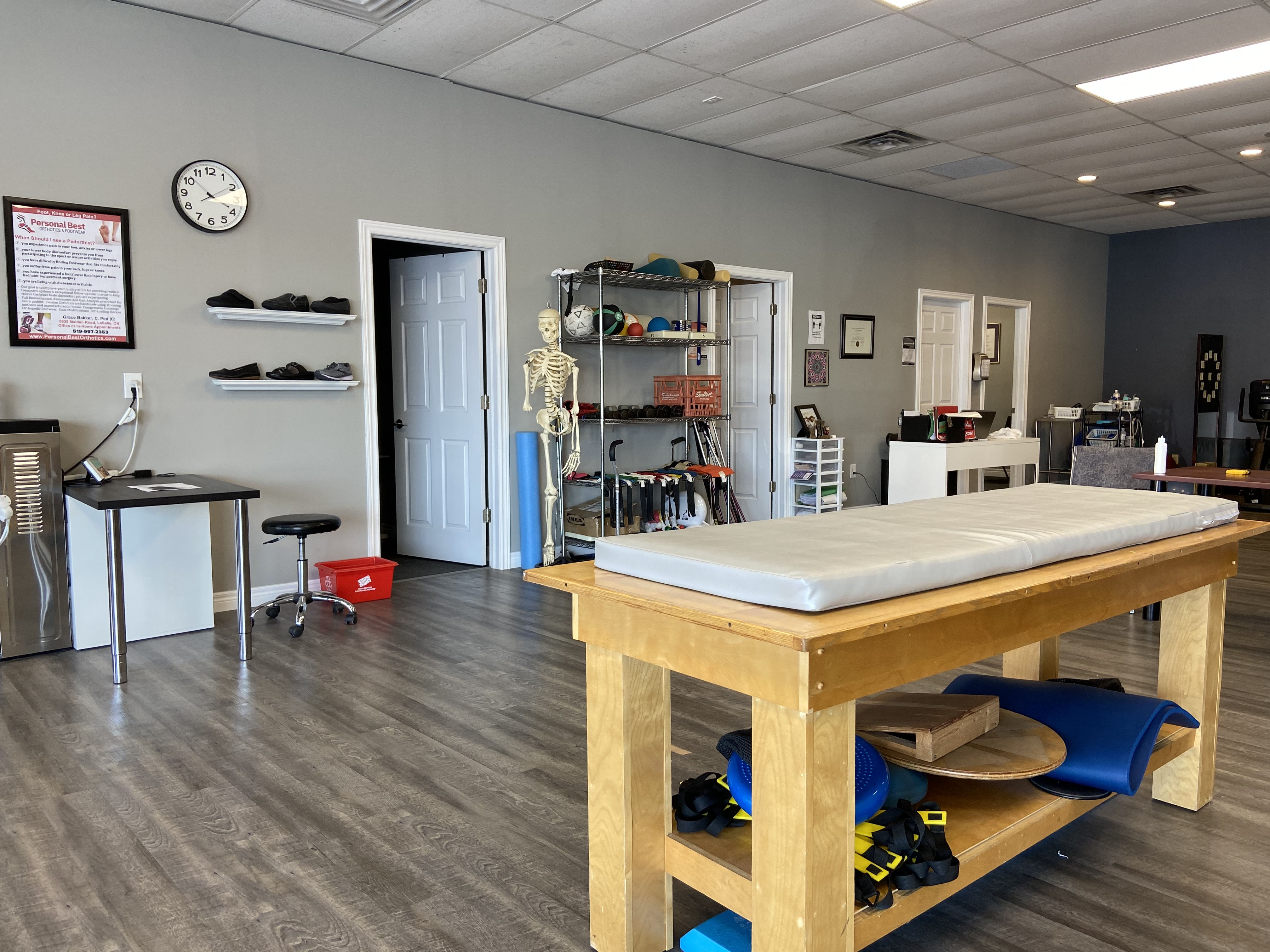 Physiotherapy clinic reception area with warm wood accents