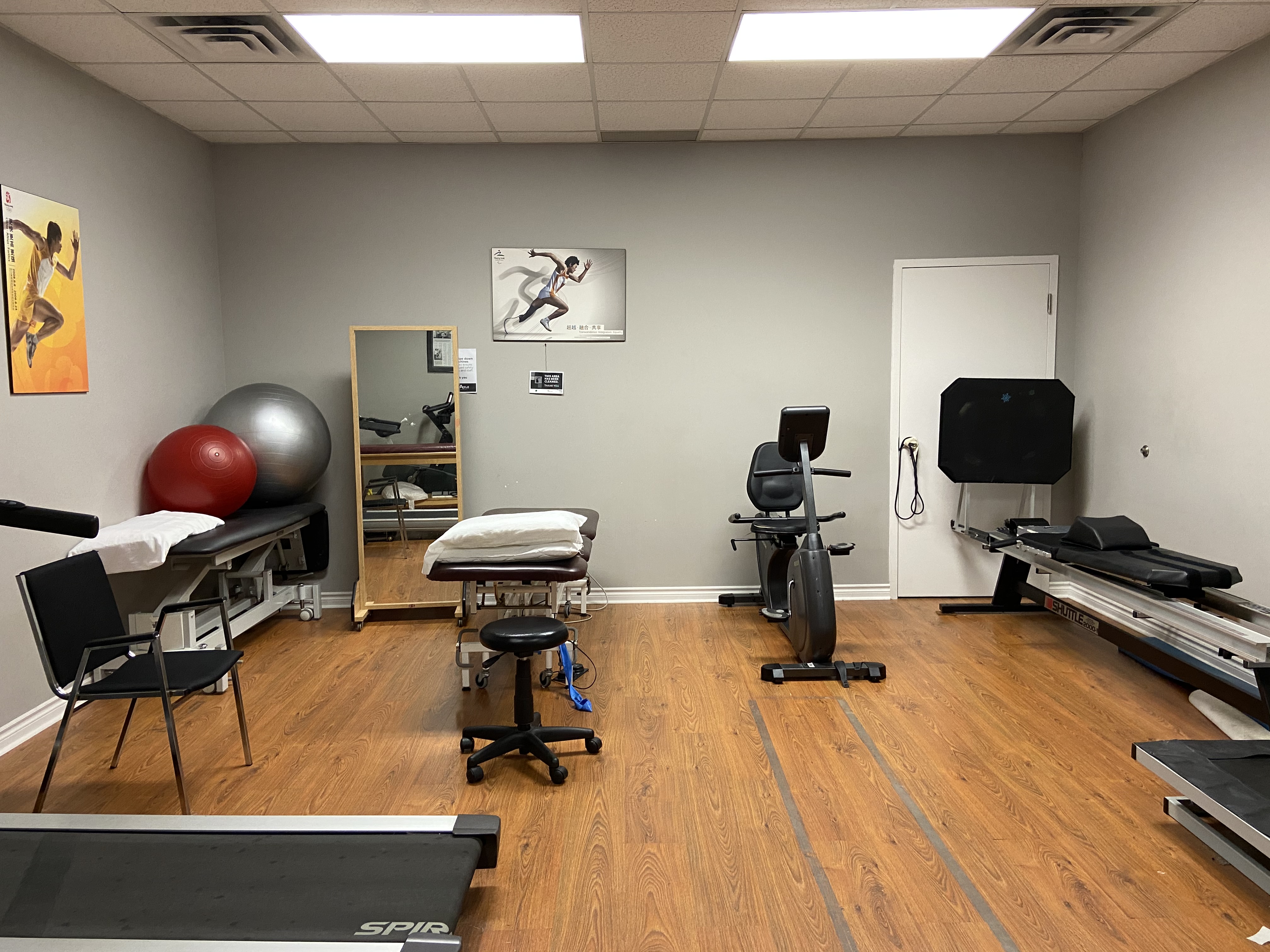 Athletic recovery area with foam rollers in a sunlit space